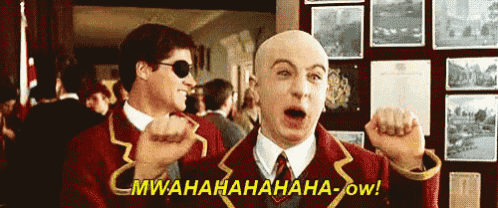 two bald men are standing next to each other and one of them is saying mwahahahaha-ow !