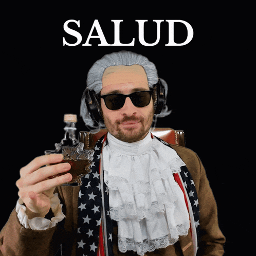 a man wearing a wig and sunglasses is holding a shot glass and the word salud is above him