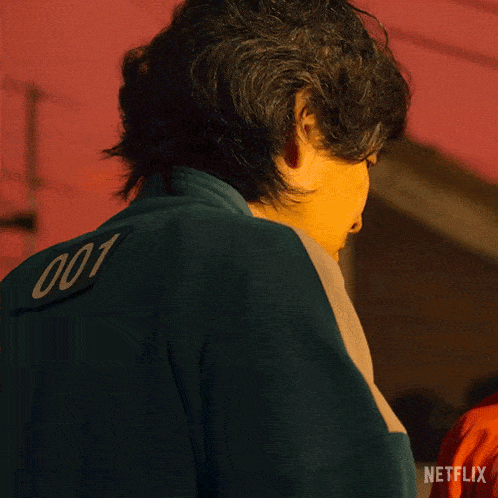 a close up of a man 's face with a netflix logo in the background
