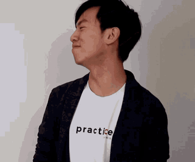 a man is wearing a white shirt that says practice