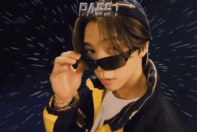 a man wearing sunglasses and a hat with the word pass written on it