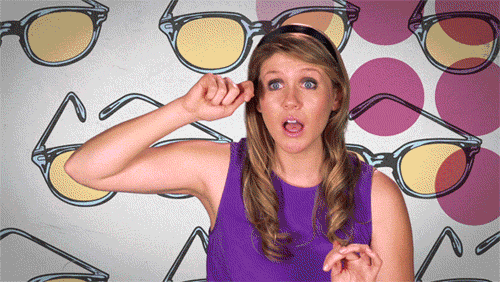 a woman in a purple dress is making a funny face