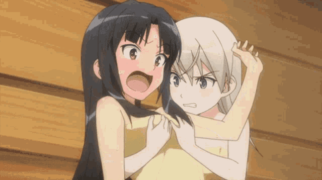 two anime girls are standing next to each other and one is angry