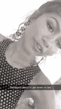 a black and white photo of a woman with a caption that says zendaya 's about to get down on set