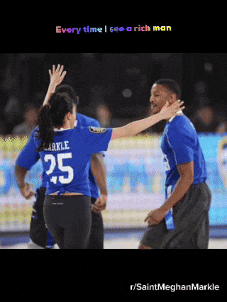 a woman wearing a number 25 jersey is giving a high five to a man