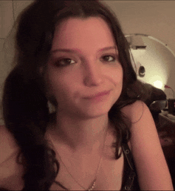 a close up of a woman 's face with her eyes closed
