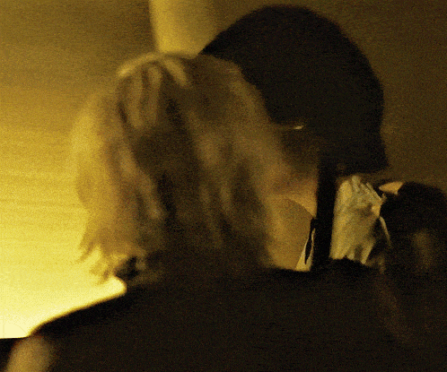 a close up of a person 's back with a blurred background
