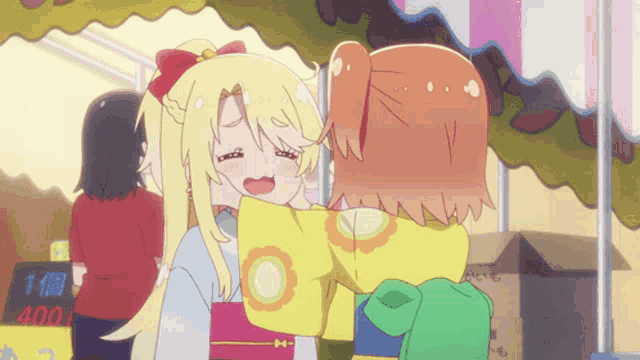 two anime girls are hugging in front of a sign that says 400 on it