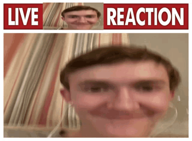 a man is smiling in front of a sign that says " live reaction "