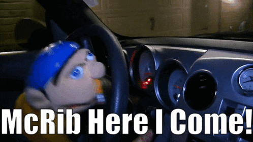 a picture of a puppet in a car with the words " mcrib here i come "