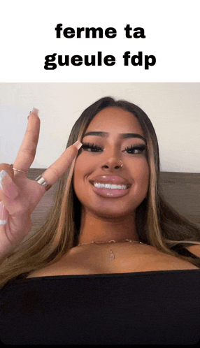 a woman giving a peace sign with the words ferme ta gueule fdp