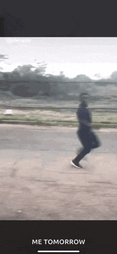 a blurry picture of a person running on a road with the words me tomorrow below them