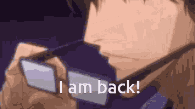 a man wearing glasses is saying `` i am back '' while looking down .