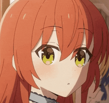a close up of a girl 's face with red hair and yellow eyes