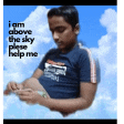 a boy in a blue shirt with the words i am above the sky please help me on it
