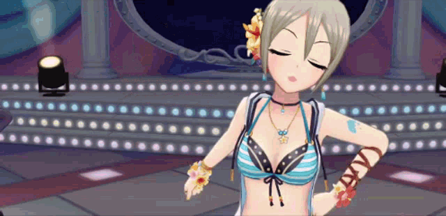 a girl in a bikini is dancing on a stage