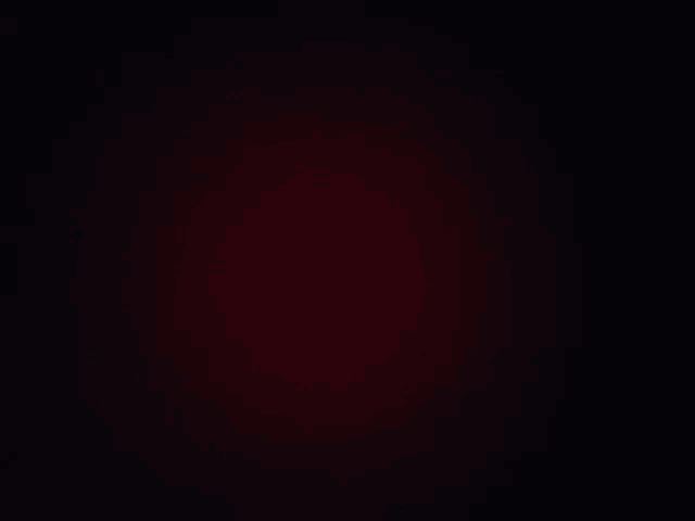 a black background with a red gradient in the middle of it