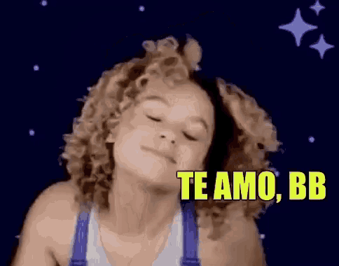 a woman with curly hair is blowing a kiss and the words te amo bb are above her head