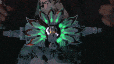 a computer generated image of a glowing sphere with green and yellow rays coming out of it
