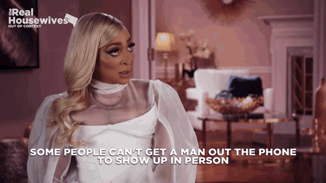 a woman in a white dress says some people can 't get a man out of the phone to show up in person