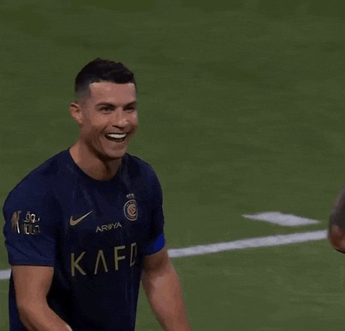 a soccer player wearing a number 10 jersey smiles on the field