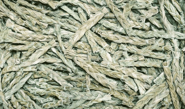 a close up of a pile of twisted grass