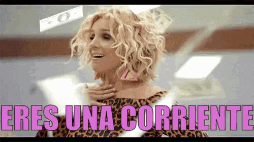 a woman in a leopard print dress says eres una corriente in pink letters