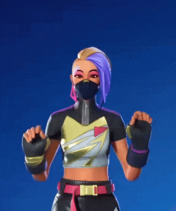 a woman wearing a mask and boxing gloves is standing with her hands in the air .