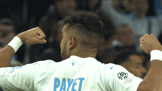 a soccer player with the name payet on his back