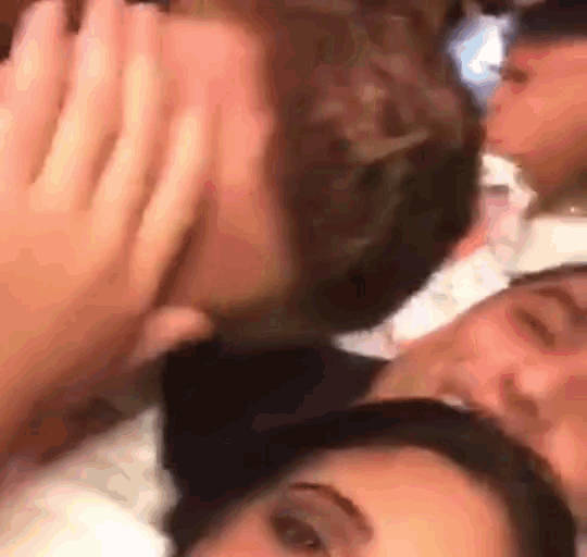 a group of people are standing next to each other .