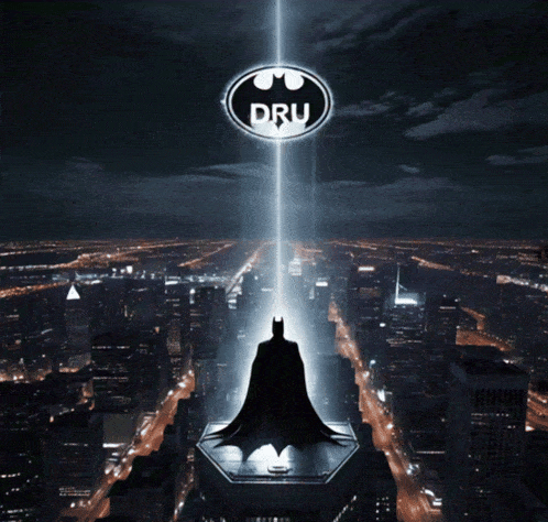 a picture of a batman standing on top of a building with the dru logo above him