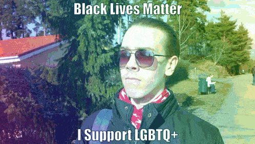 a man wearing sunglasses and a scarf stands in front of trees and says black lives matter i support lgbtq+