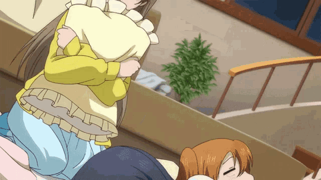 a girl in a yellow shirt is hugging another girl