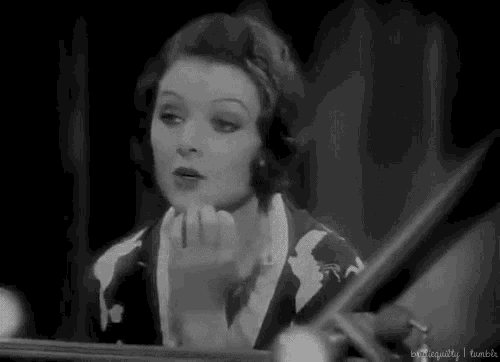 a black and white photo of a woman looking at herself in a mirror with the words " extraordinarily i tumblr " at the bottom