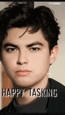 a close up of a young man 's face with the words `` happy tasking '' written below him .
