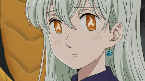 a close up of a girl wearing earrings and a blue pendant .