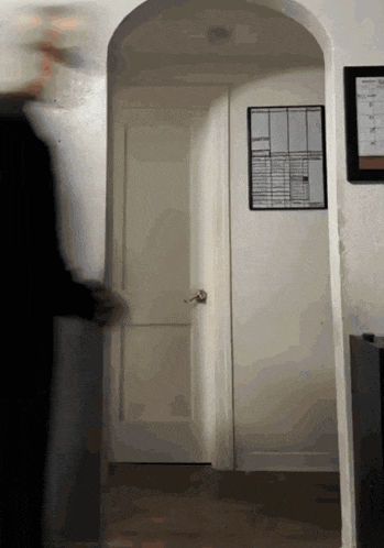 a doorway with a calendar on the wall that says ' sunday ' on it