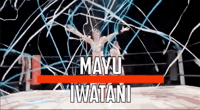 a woman is standing in a wrestling ring with her arms outstretched and the words mayu iwatani on the bottom .