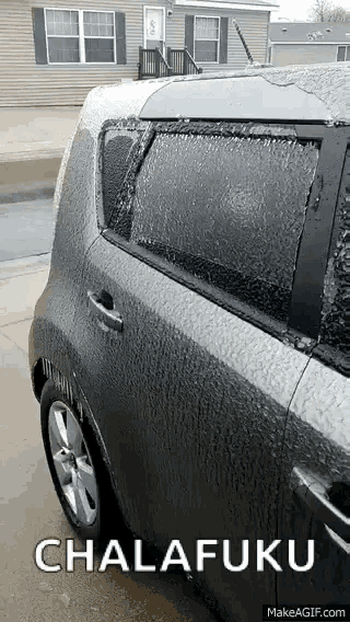 a car is covered in a thick layer of ice and says chalafuku on the bottom
