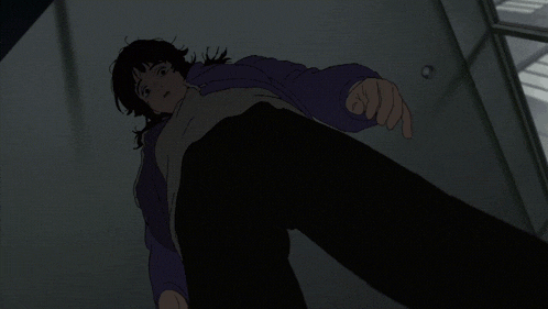 a person in a purple hoodie is laying on the floor