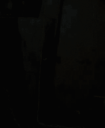 a door in a room with a picture on the wall