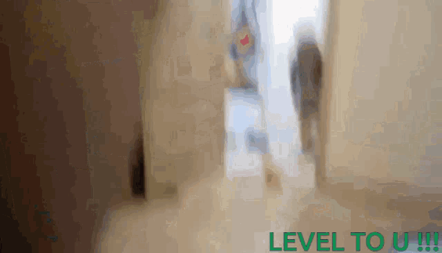 a blurry picture of people walking with the words level to u