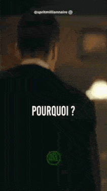 a man in a suit is standing in a dark room with the words `` pourquoi '' written on the bottom .