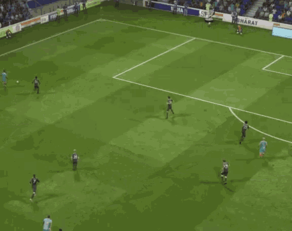 a soccer game is being played on a field with a banner that says " bharat "