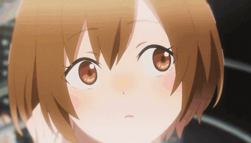 a close up of a girl with brown eyes