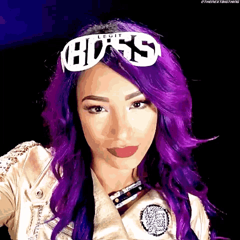 a woman with purple hair is wearing a headband that says ' legit boss '