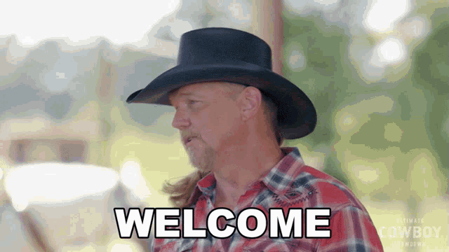 a man wearing a cowboy hat and plaid shirt says welcome