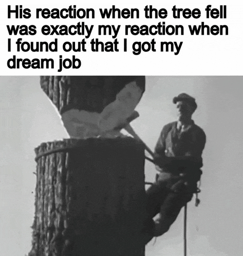 a black and white photo of a man climbing up a tree stump
