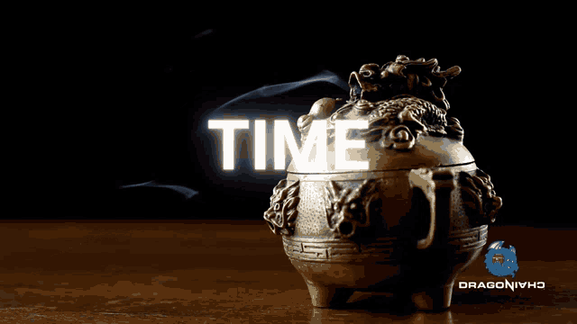 a dragon incense burner with the word time written on it