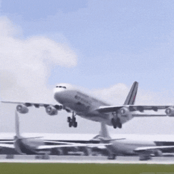 a large airplane is taking off from a runway